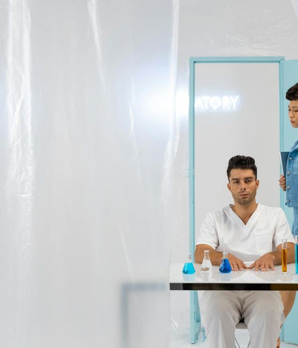 Professional team testing household appliances in modern laboratory